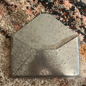 Hanging metal wall mail carrier